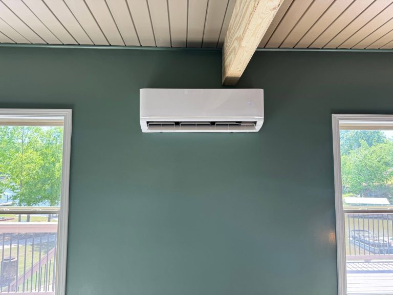 Indoor mini-split unit on a green wall