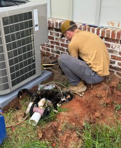 Hardin technician working at an outdoor unit