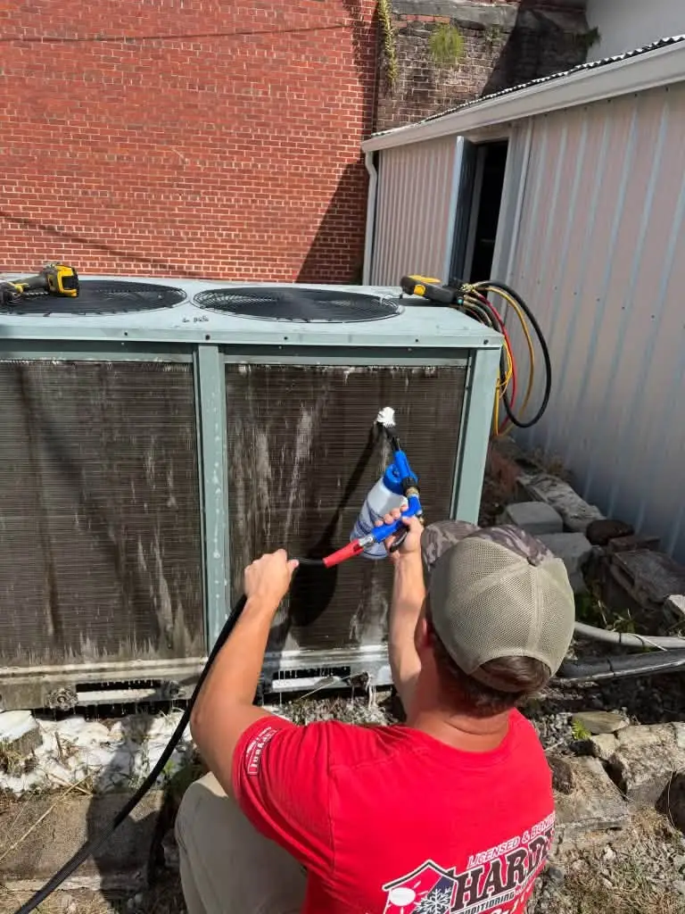 Hardin technician cleaning a commercial unit coil